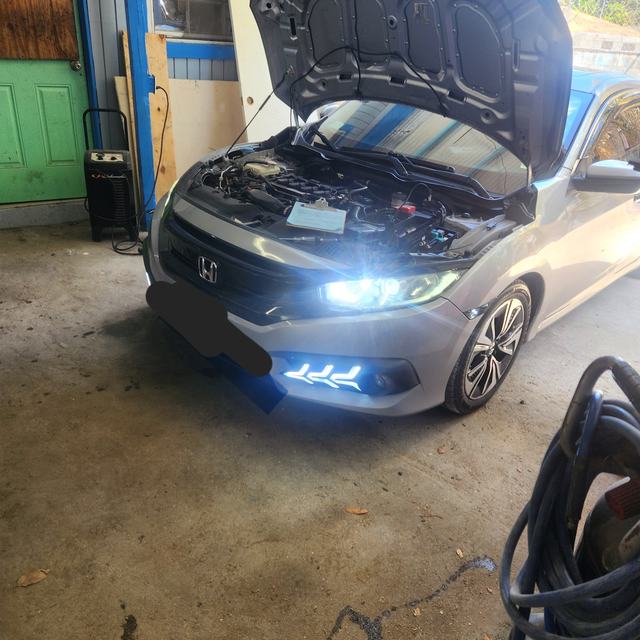 Car in the bay with the hood up